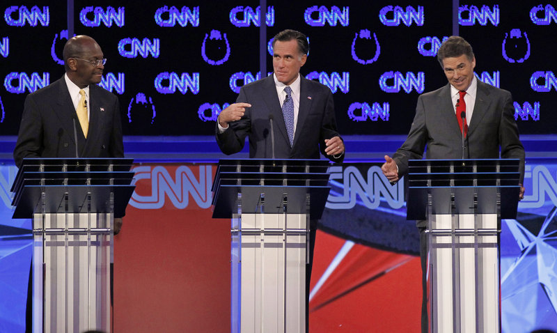 Herman Cain, Mitt Romney and Rick Perry in a Republican debate.