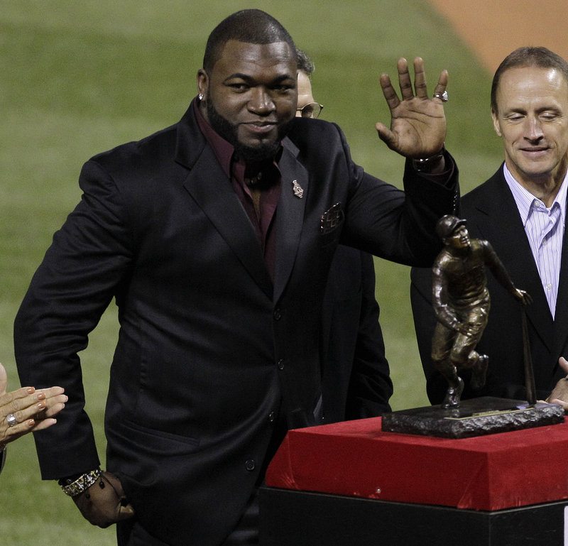 David Ortiz of the Red Sox waves during a ceremony before Game 2 of the World Series as he receives the Roberto Clemente Award for community service and excellence on the field.