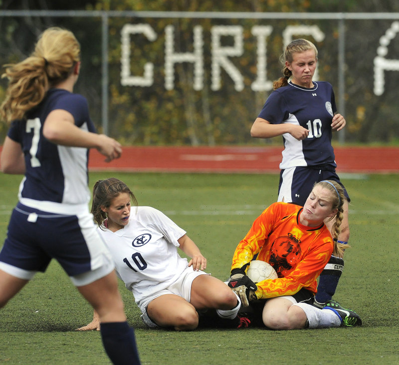 Fryeburg Academy goalie Maggie McConkey holds on to the ball during a collision with Yarmouth’s Tess Merrill in a Western Class B girls’ soccer prelim Friday. Yarmouth advanced to the quarterfinals.