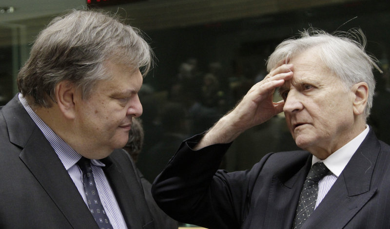 Greek Finance Minister Evangelos Venizelos, left, talks to European Central Bank President Jean-Claude Trichet in Brussels on Saturday. New rules would require the EU’s biggest banks to raise about $140 billion to ensure that they could withstand a panic caused by a cut to Greece’s debt.