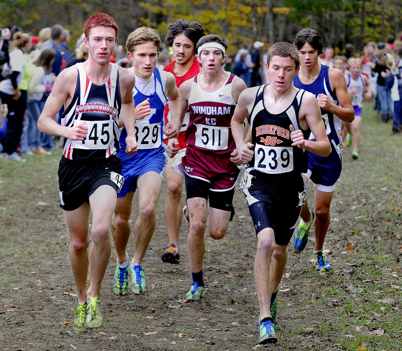 The leaders in the Western Class A boys’ race Saturday were bunched early. Nick Morris of Scarborough, left, won it. Chris Dunn of Kennebunk (329) was second. Challenging were Keegan Brennan of Windham (511) and Cameron Nadeau of Biddeford (239).