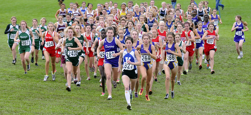 Abbey Leonardi of Kennebunk is at the head of the pack Saturday at the start of the Western Class A girls’ cross country meet at Twin Brook Recreation Area. Leonardi was the individual winner while Cheverus captured the team title to join Class B Greely and Class C Merriconeag.