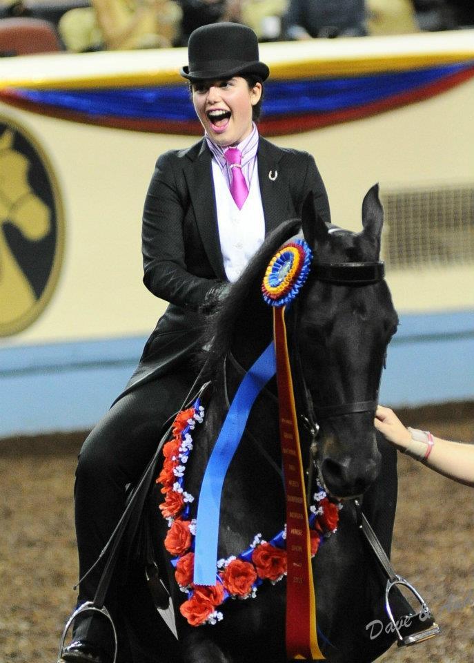 Gabrielle Blackman celebrates on her horse after winning the Classic Pleasure Saddle competition at the National Morgan Horse Show in Oklahoma City.