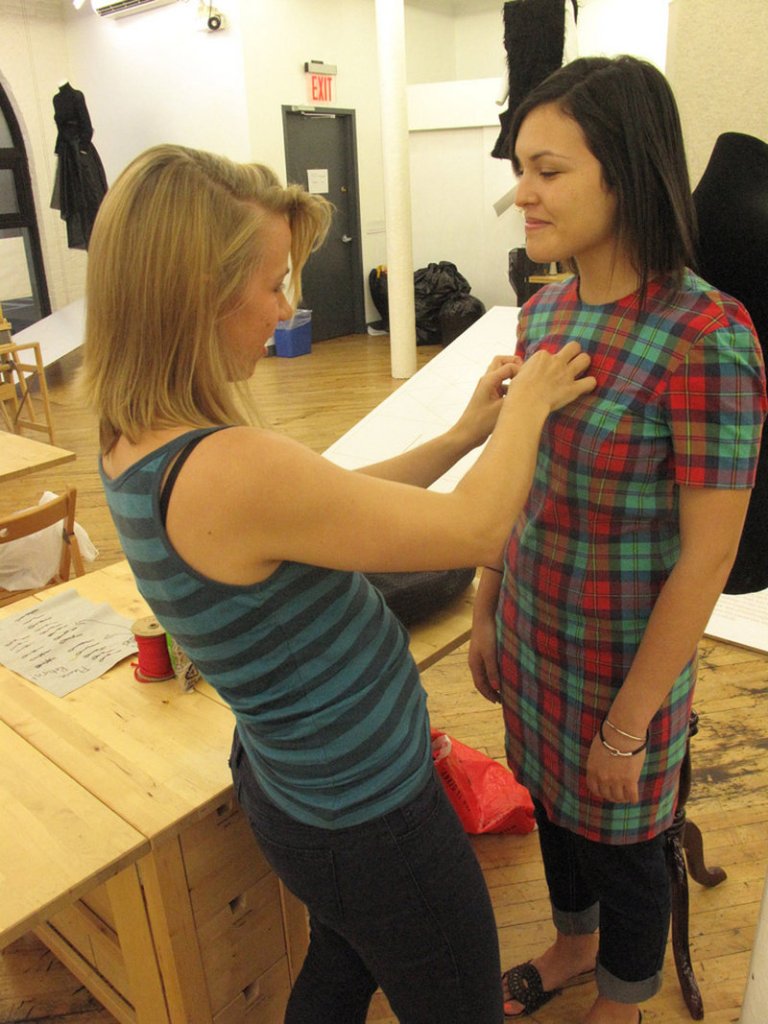 Mariel Zook, left, redesigns an old dress with Mimi Galvez. Sewing Rebellion offers instruction for all skill levels.