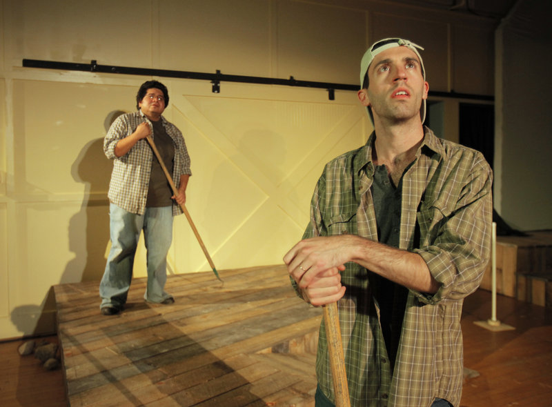 Jae Rodriguez, left, and Chris Reiling, two of the actors in “Farms and Fables,” rehearse a scene Wednesday at Camp Ketcha in Scarborough. The play was conceived by Jennie Hahn and written by Cory Tamler, utilizing hands-on experience at several farms.
