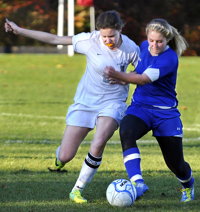 Becky Smith, left, of Waynflete fights off Miranda Lessard of Old Orchard Beach in their Western Class C semifinal Friday in Portland. Smith scored for a 1-0 victory.