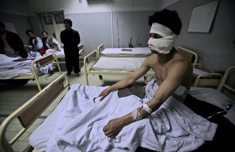 Ahmad Fawad, 20, who was injured by a suicide car bomb, sits in a hospital bed after receiving treatment in Kabul, Afghanistan, on Saturday.