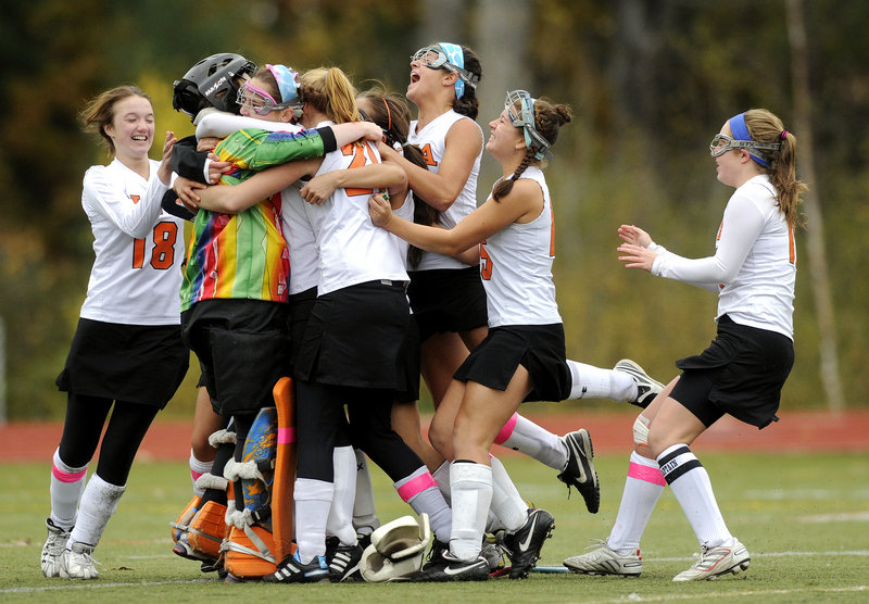 Game over, title won, and the North Yarmouth Academy field hockey team celebrated a 1-0 victory against Winthrop on penalty corners – and a second consecutive Class C state championship.