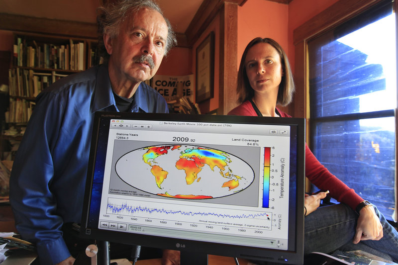 Richard Muller and his daughter, Elizabeth Muller, display a map from their study on climate, in Berkeley, Calif.