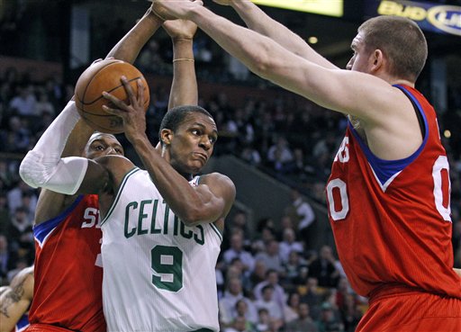 Boston Celtics guard Rajon Rondo looks to pass against the Philadelphia 76ers. According to Sports Illustrated report on Nov. 29, the Celtics may trade Rondo for New Orleans Hornets point guard Chris Paul.