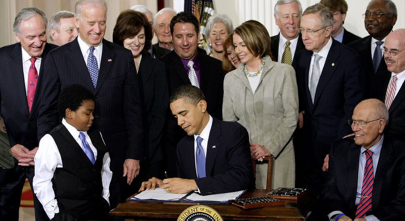 President Obama signs the health care bill in the East Room of the White House on March 23, 2010. The Supreme Court said Monday it will hear arguments in March over the overhaul, setting up an election-year showdown over the White House's main domestic policy achievement.