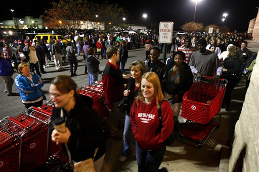 Customers, showing up early to stand in line, are allowed into Target in Horn Lake, Miss., on Black Friday, Nov. 25, 2011. Early signs point to bigger crowds at the nation's malls and stores as retailers like Macy's and Target opened their doors at midnight. Toys R Us and a few stores other stores that opened on Thanksgiving Day also were filled with shoppers.(AP photo/The Commercial Appeal. Stan Carroll) Holiday Shopping Black Friday