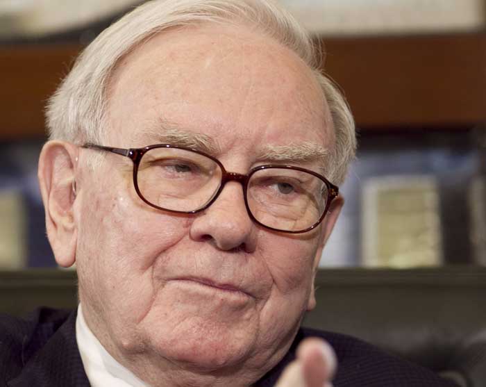 Warren Buffett, chairman and CEO of Berkshire Hathaway, gestures during an interview, in Omaha, Neb., recently.