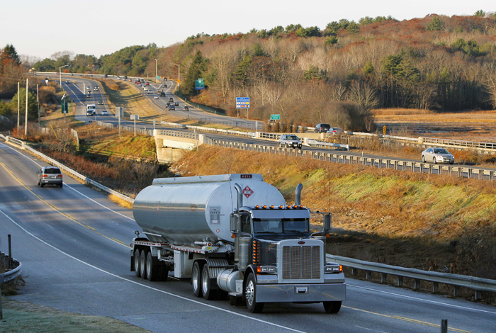 A heavy truck travels north on Route 1, alongside Interstate 295, in Yarmouth recently. Congress' vote to increase truck weight limits on federal highways in Maine and Vermont highlights the arguments for and against allowing heavier trucks on the nation's interstates.