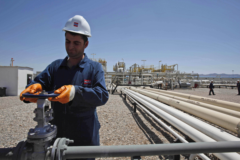 An employee works at the Tawke oil fields in the semiautonomous Kurdish region in northern Iraq on May 31, 2009. A Kurdish official says the Kurdish government has signed a deal with ExxonMobil to explore oil fields in northern Iraq.