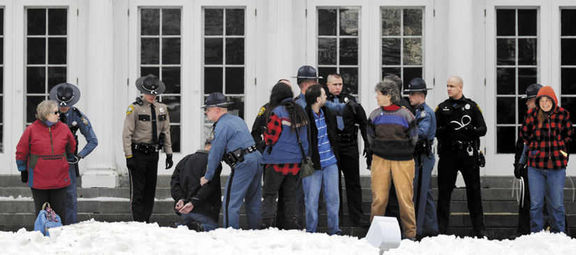 Protesters are arrested today on the lawn of the Blaine House during a rally by Occupy Augusta. Police say eight people were charged with criminal trespass and failure to disperse after refusing to leave the lawn of the governor's mansion.