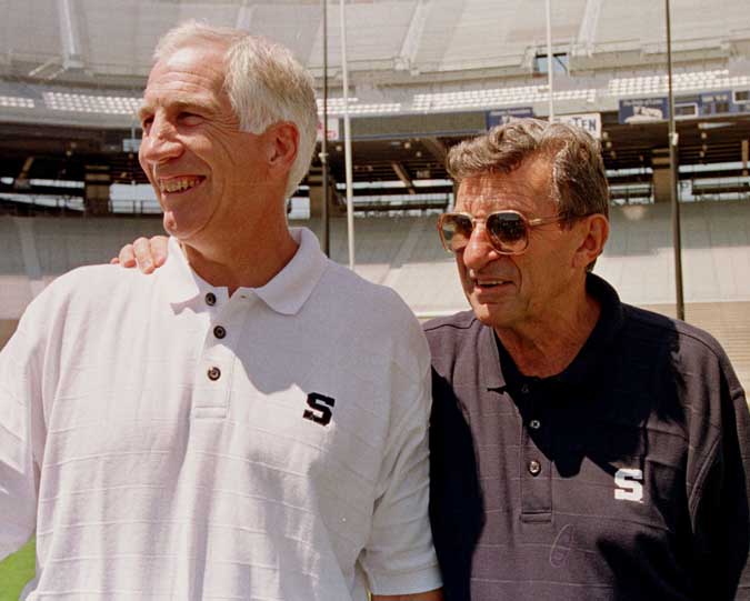 In this Aug. 6, 1999, photo, Penn State head football coach Joe Paterno, right, poses with Jerry Sandusky, his defensive coordinator at the time.