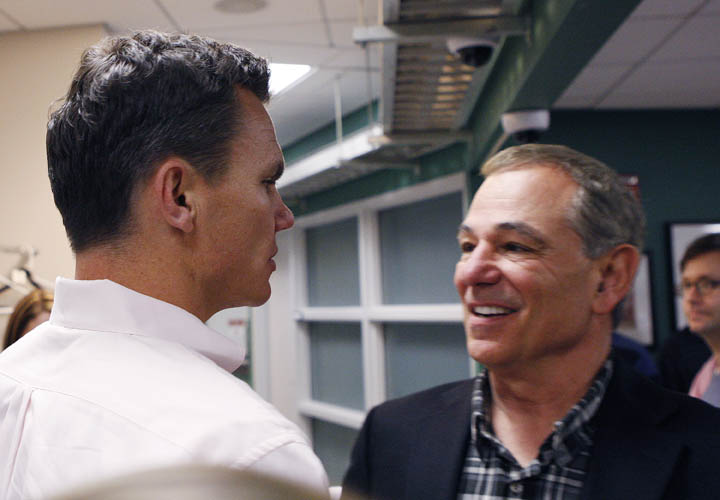 ESPN analyst Bobby Valentine, right, shakes hands with Boston Red Sox general manager Ben Cherington following his interview for the vacant Boston Red Sox manager position at Fenway Park on Nov. 21, 2011. Valentine has acknowledged that it's tough waiting for the Red Sox to make a decision and that he really wants the job.