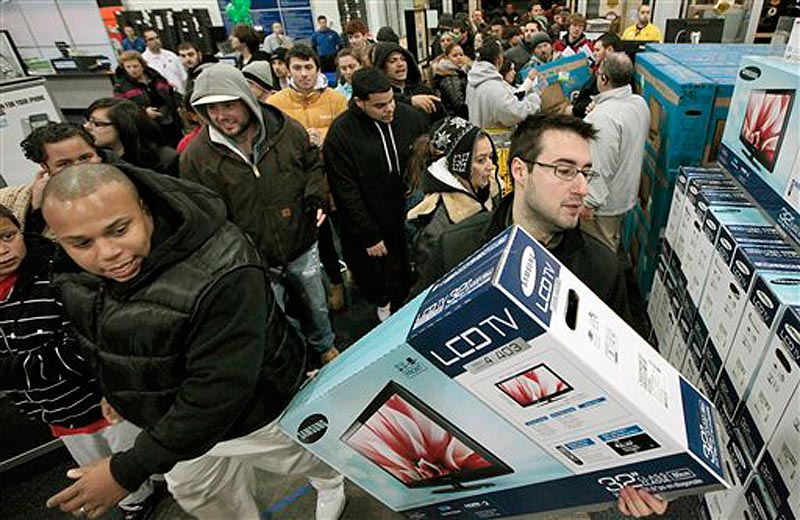 BlackÜFriday shoppers rush into Best Buy in North Dartmouth, Mass., early Friday, Nov. 25, 2011. Thousands of shoppers lined up at Macy's, Best Buy and other stores nationwide to buy everything from toys to tablets on Black Friday despite the economic downturn and some planned protests of the shopping holiday. (AP Photo/The Standard-Times, Peter Pereira) shop shopping buy economy black friday line wait money budget el