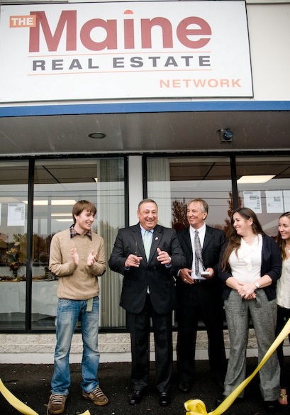 Gov. Paul LePage, second from left, recently attended a ribbon-cutting as The Maine Real Estate Network opened offices at 183 US Route 1 in Falmouth. Joining him, from left, are John Logan Jones, David Jones, Nancy Jones and Lauren Jones. The agency is one of five new businesses that began operating last month in the former Portland Saab building. The other companies include Falmouth Antiques & Furniture, Foreside Insurance Group, Fit 212 and Jones Building & Development. Town officials attending the Oct. 13 ceremony included Falmouth Town Manager Nathan Poore, several town councilors and Jonathan Berry, president of the Falmouth Economic Development Commission.