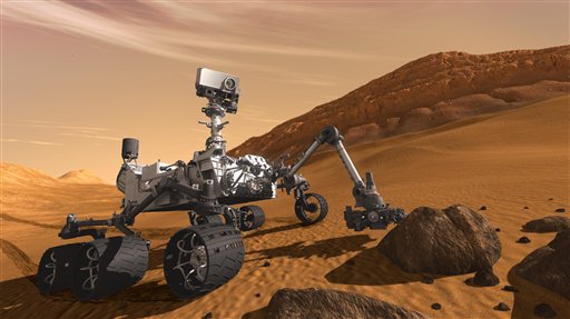 FILE - In this 2011 artist's rendering provided by NASA/JPL-Caltech, the Mars Science Laboratory Curiosity rover examines a rock on Mars with a set of tools at the end of its arm, which extends about 2 meters (7 feet). The mobile robot is designed to investigate Mars' past or present ability to sustain microbial life. NASA is all set to launch the world's biggest extraterrestrial explorer. The six-wheeled, one-armed Mars rover is due to blast off Saturday morning Nov. 26, 2011 from Cape Canaveral. (AP Photo/NASA/JPL-Caltech)
