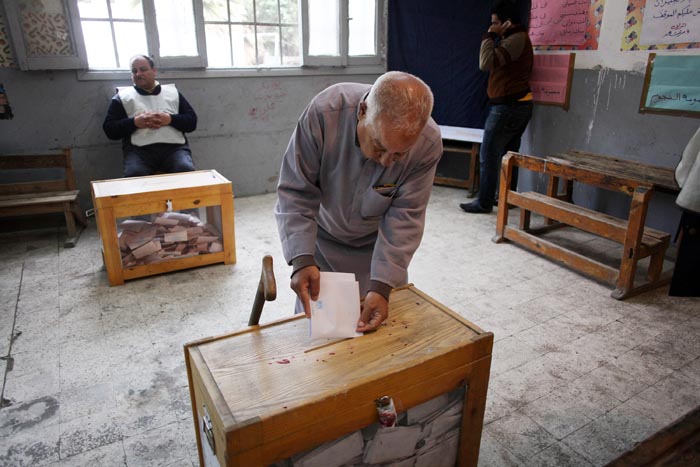 A man casts his ballot on the second day of parliamentary elections in Cairo, Egypt, today.