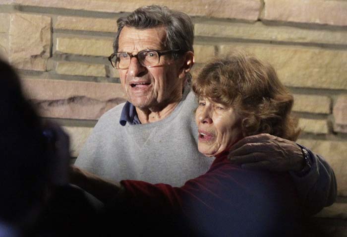 Joe Paterno and his wife Susan stand on their porch to thank well-wishers gathered outside in State College, Pa., on Wednesday.