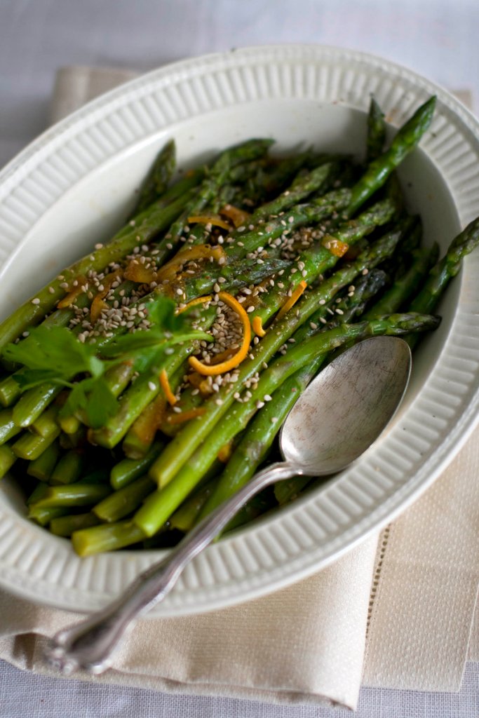 Citrus-glazed asparagus is dusted with toasted sesame seeds before serving.