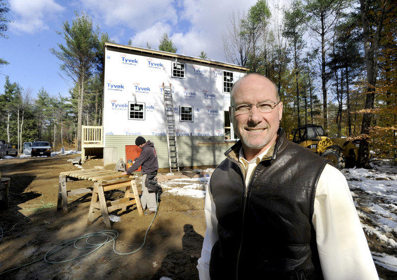 Mark Patterson, owner of Patco Construction, expects to build 25 single-family homes this year, compared to 53 in 2002, and so keeps fewer workers employed. He’s shown here at a home his company is building in Lebanon.