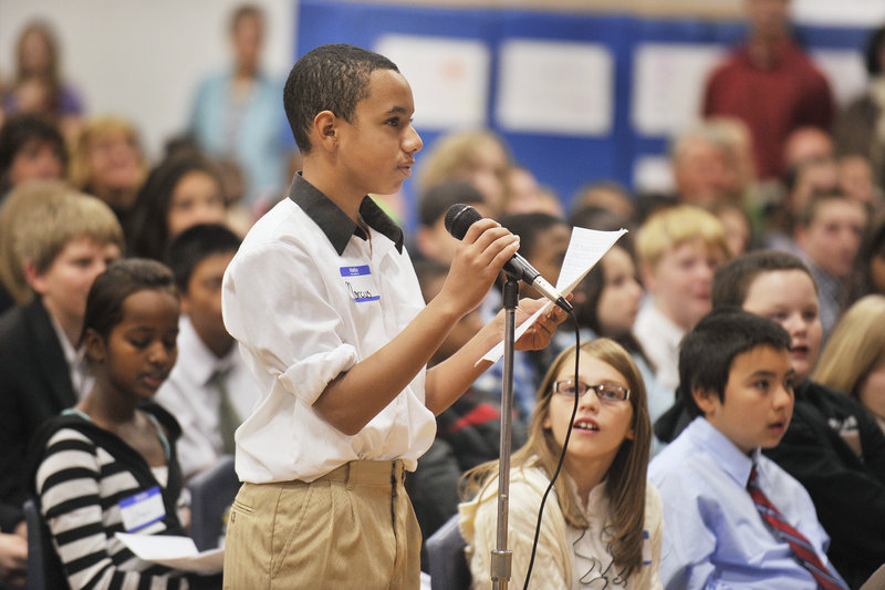 Seventh-grader Marcus Stevens asks a question during Thursday’s forum at Lyman Moore Middle School as the mayoral candidates made one of their final pitches to voters.