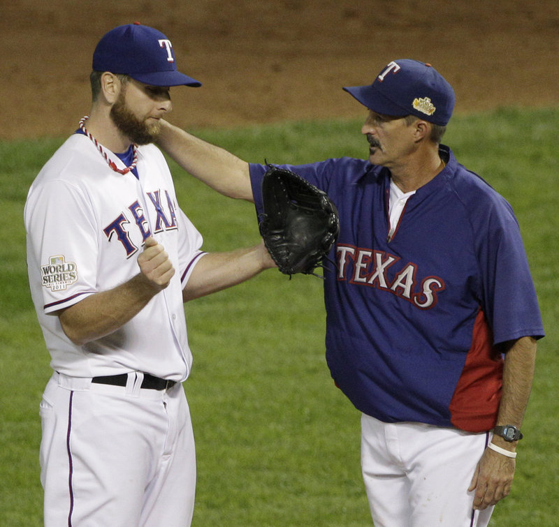 Texas Rangers hitting coach Mike Maddux, right, will be interviewed by both the Red Sox and Cubs as they look to fill their managerial openings.