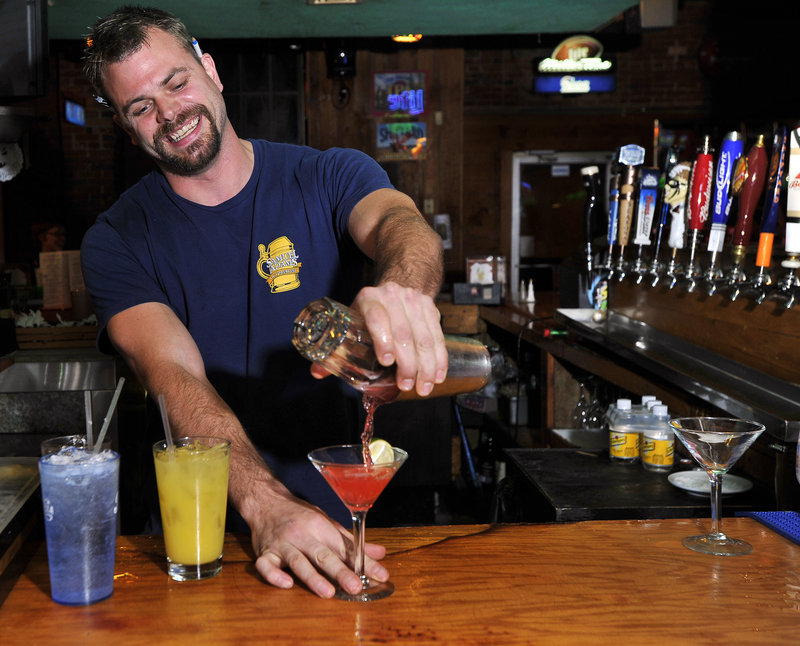 Tim Roberge sets a fast pace behind the bar at Mulligan’s in Biddeford.