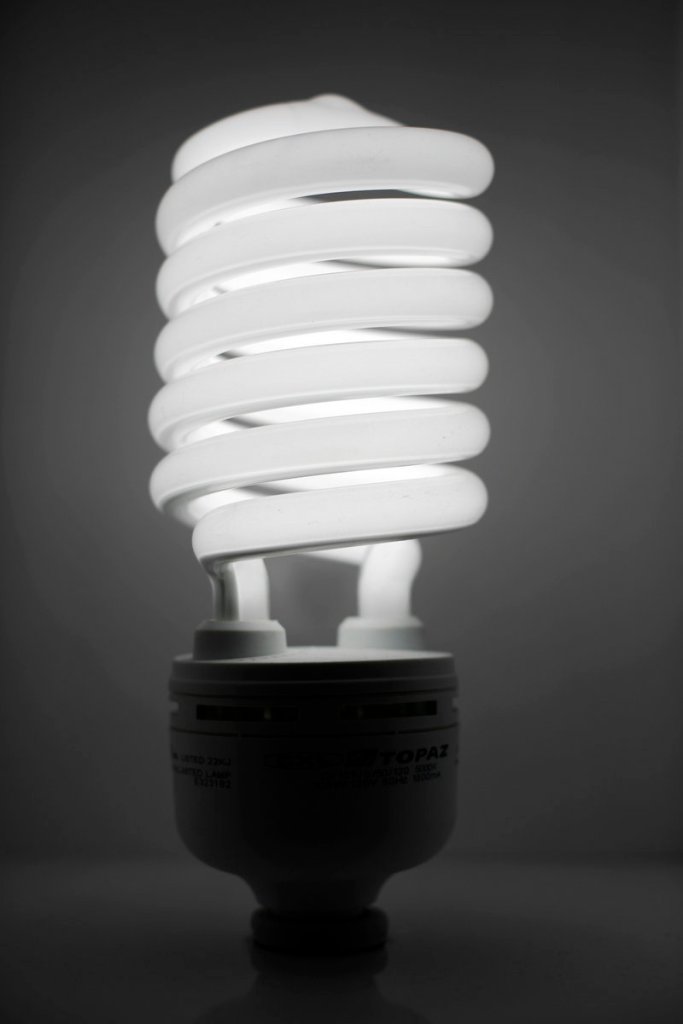 Compact fluorescent light bulbs reduce energy consumption and greenhouse gas emissions.