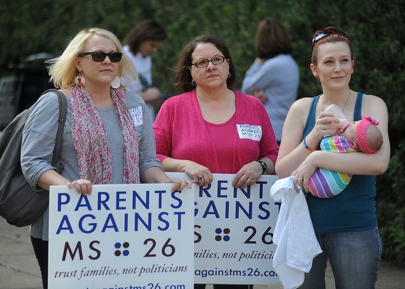 Parents against the MS 26 initiative attend a rally at the state Capitol in Jackson, Miss., on Thursday. Mississippi doctors gathered at the Capitol to express their opposition, supported by the Mississippi Nurses Association.