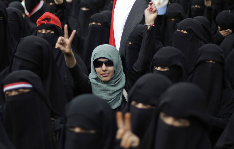 A female protester flashes the victory sign during a Sept. 6 demonstration in San'a, Yemen, demanding the resignation of President Ali Abdullah Saleh. Islamic elements are cracking down on women who have joined the revolt.