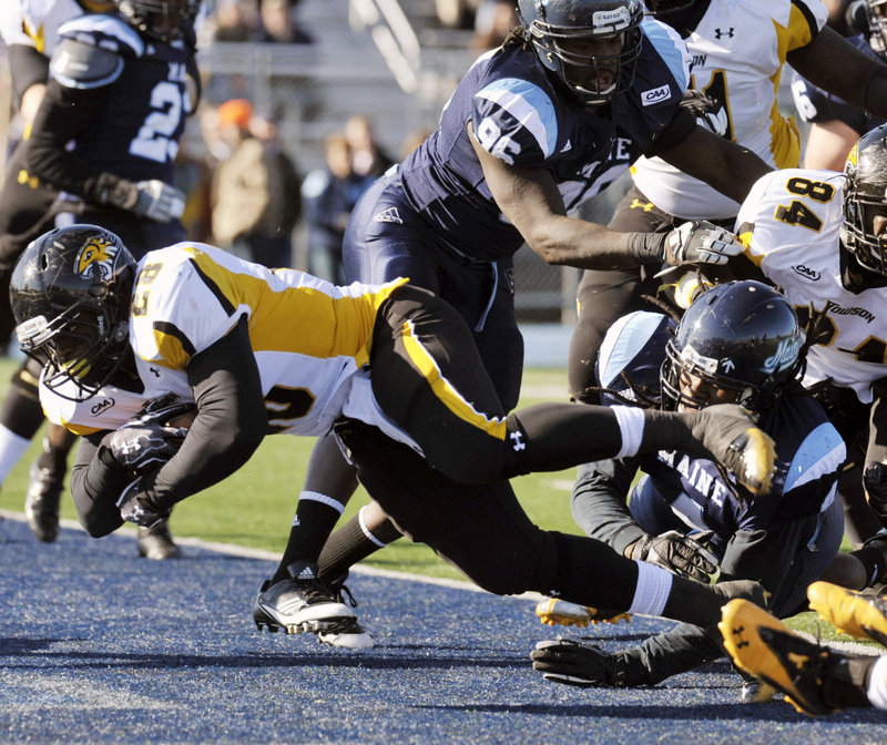 Terrance West of Towson scores in the first half against UMaine on Saturday at Orono. West ran for 184 yards in Towson’s 40-30 win.