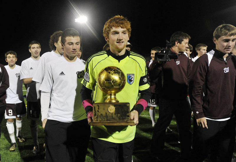Windham keeper Dana King played a huge part in the Class A boys' soccer state final Saturday night, and got to carry the Gold Ball after the 3-1 victory against Messalonskee at Falmouth High. It was the first boys' soccer state championship for Windham.