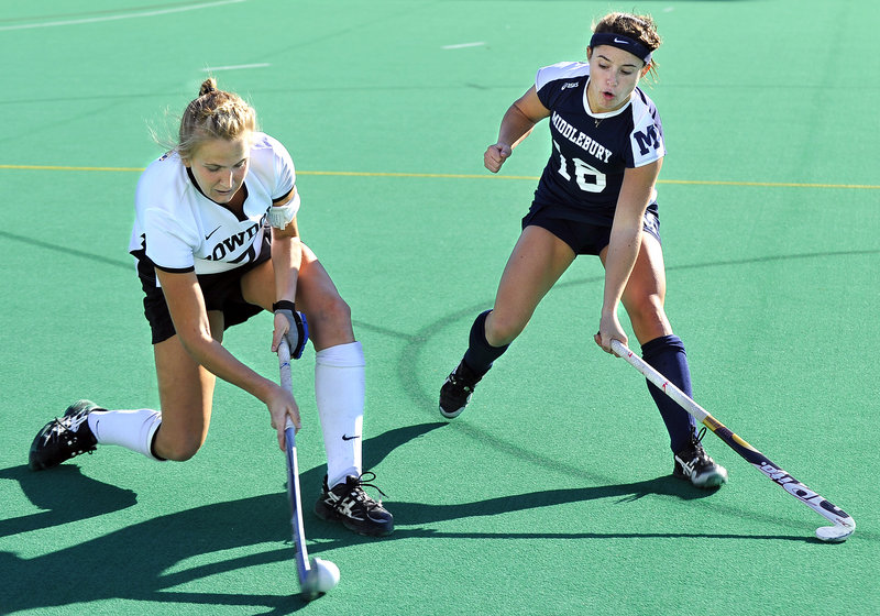 Ella Curren of Bowdoin takes a shot while being defended by Middlebury’s Hannah Clarke Sunday in the NESCAC title game.