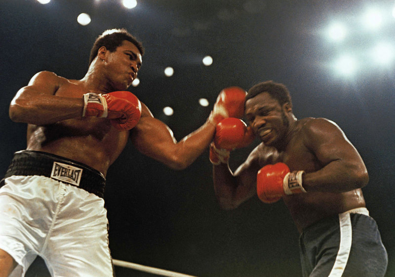 Joe Frazier, right, slugs it out with Muhammad Ali during a fight at Madison Square Garden – the second of their three fights. Frazier won the first, then lost the next two.