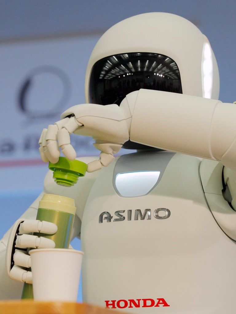 Asimo has the ability to gracefully pour juice into a paper cup.