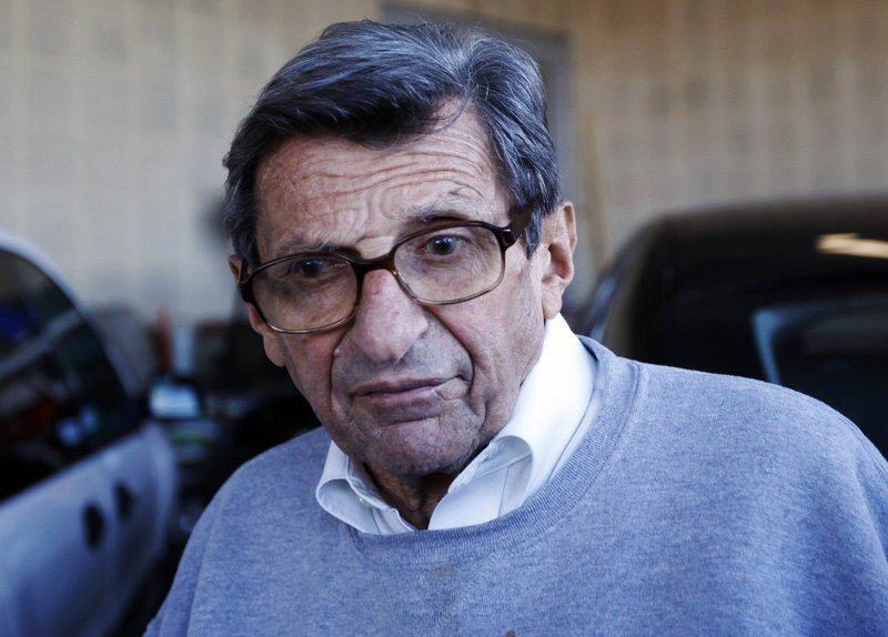 Head coach Joe Paterno leaves the football building on the Penn State campus Tuesday. University officials canceled his weekly news conference.