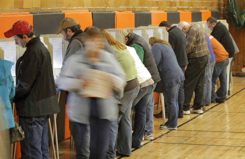 Voters cast ballots at Biddeford’s Richard J. Martin Community Center Tuesday. Wards reported better than 50 percent turnout.