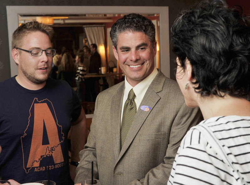 Portland mayoral candidate Ethan Strimling mingles with some of his supporters Tuesday night at Havana South on Wharf Street. Strimling is hoping Round 2 of ranked-choice voting tabulation will favor him.