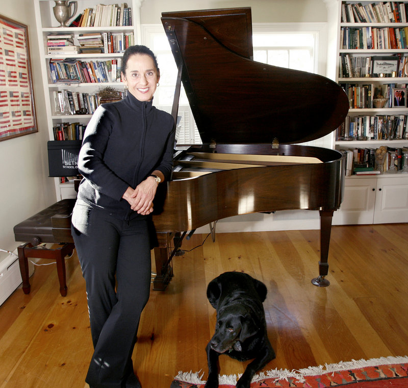 Janna Hymes and Winston at her restored 1850s home in Rockport. Hymes keeps it simple with Maine Pro Musica, the orchestra she founded in 2008, with no bureaucracy to speak of. She and the professional musicians of MPM have no home auditorium; rather, they traverse the state to perform in towns such as Ellsworth, Fryeburg, Rockland and Damariscotta.