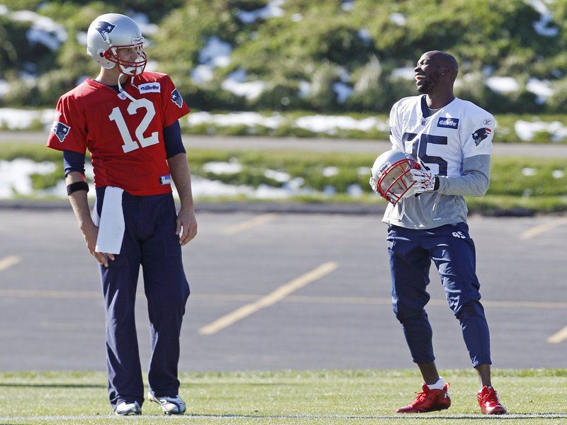 Tom Brady, left, and Chad Ochocinco still have to learn to connect as well on the field as they have during practice time with the Patriots.