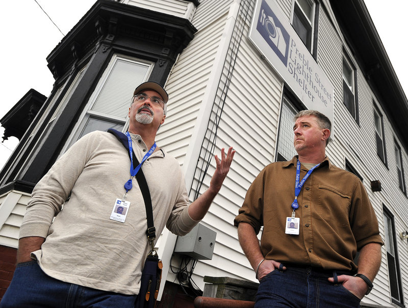 Mark Swann, left, executive director of Preble Street, and Chris Bicknell, teen services coordinator, discuss the need for a new Preble Street Lighthouse Shelter on Thursday on Elm Street.