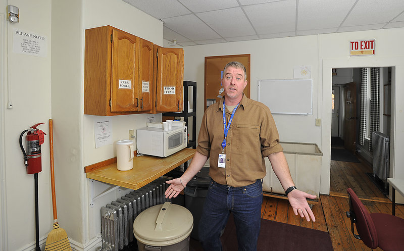 Chris Bicknell, teen services coordinator at Preble Street, explains how the kitchen space and the rest of the facility is inadequate to serve the needs of homeless teenagers at the present location of the Preble Street Lighthouse Shelter.