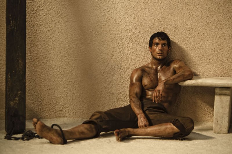 Henry Cavill stars as Theseus, who is chosen by Zeus to battle an evil king played by Mickey Rourke in “Immortals.”