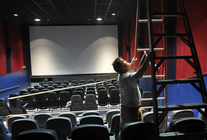 Jeff Savoie of S&B Mechanical works on the heating and cooling system Thursday at the new Nordica Theatre in Freeport, where finishing touches are being completed to prepare for the theater s opening next week.