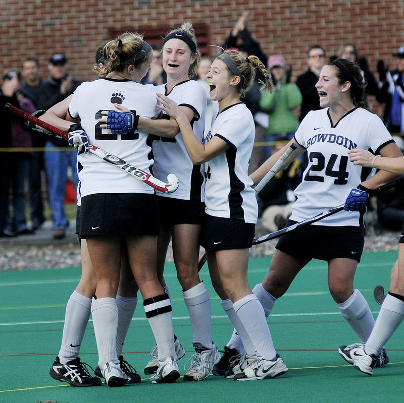 Bowdoin players celebrate a goal Sunday against MIT. Left to right are Katie Herter (back to camera), Elizabeth Clegg, Molly Paduda and Kassey Matoin. Bowdoin won 3-0 and is headed to the Final Four against Middlebury.